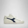 Game L Waxed Row Cut Chaussures de sport – Unisexe Game L Waxed Row Cut Chaussures de sport – Unisexe